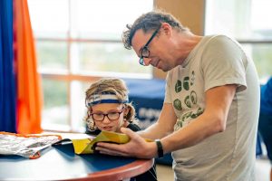Parent and Child Reading at a Table