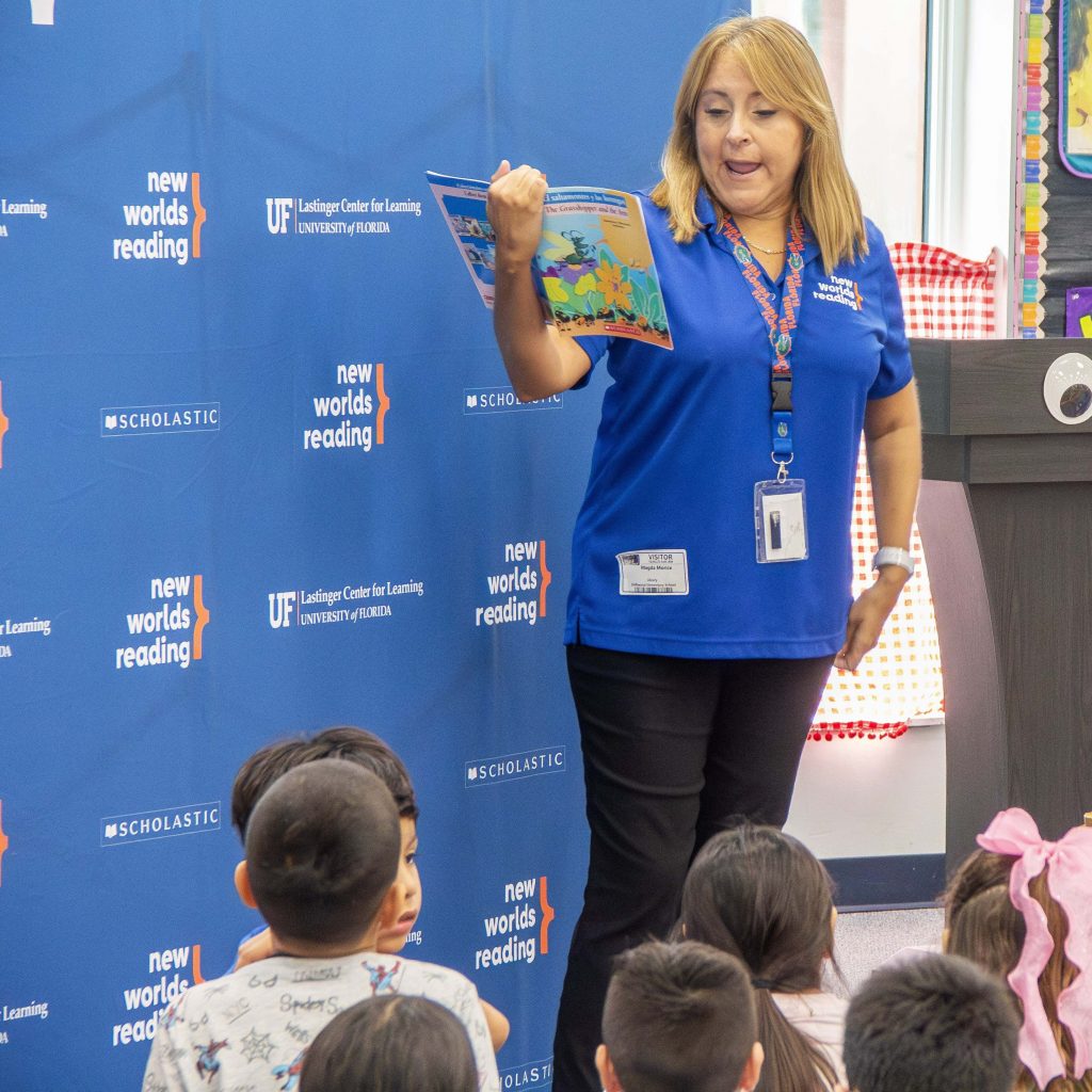 Magda Read Aloud A New Worlds Reading Community Engagement specialist reading a book aloud to kids.