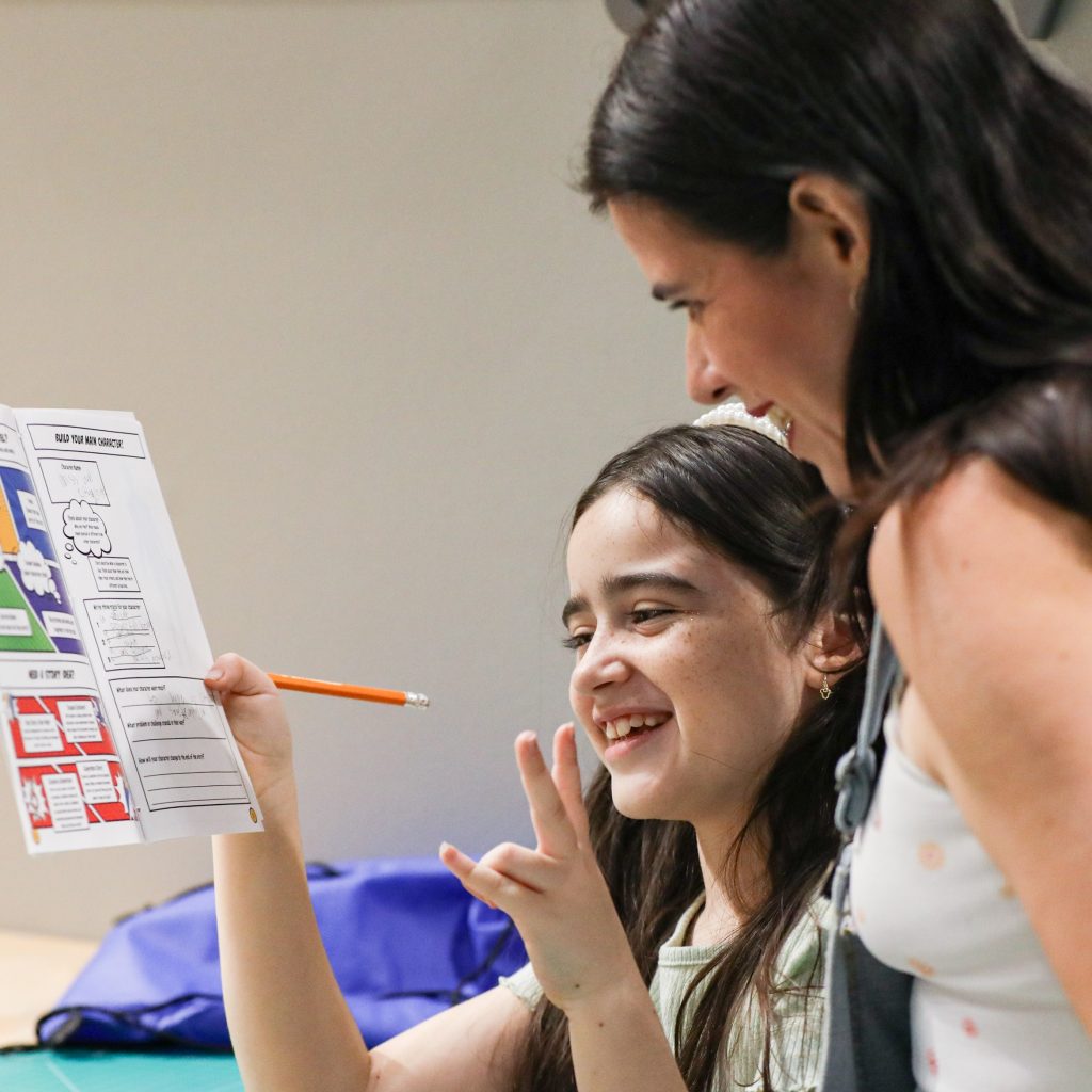 Book Bash 2026-225 A mother and daughter completing a New Worlds Reading activity.