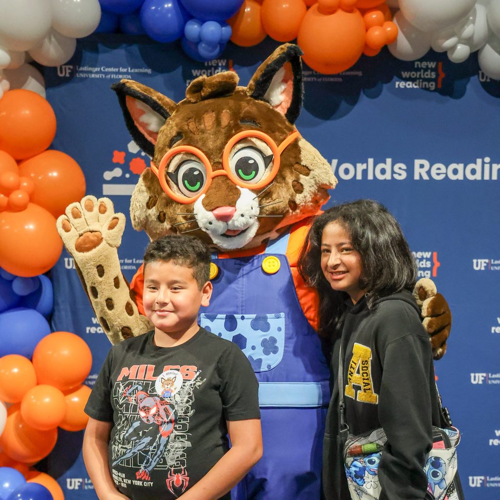 Brooks posing with two children.